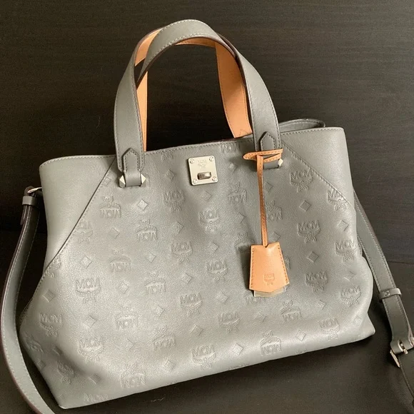 Mcm essential embossed online leather bucket bag